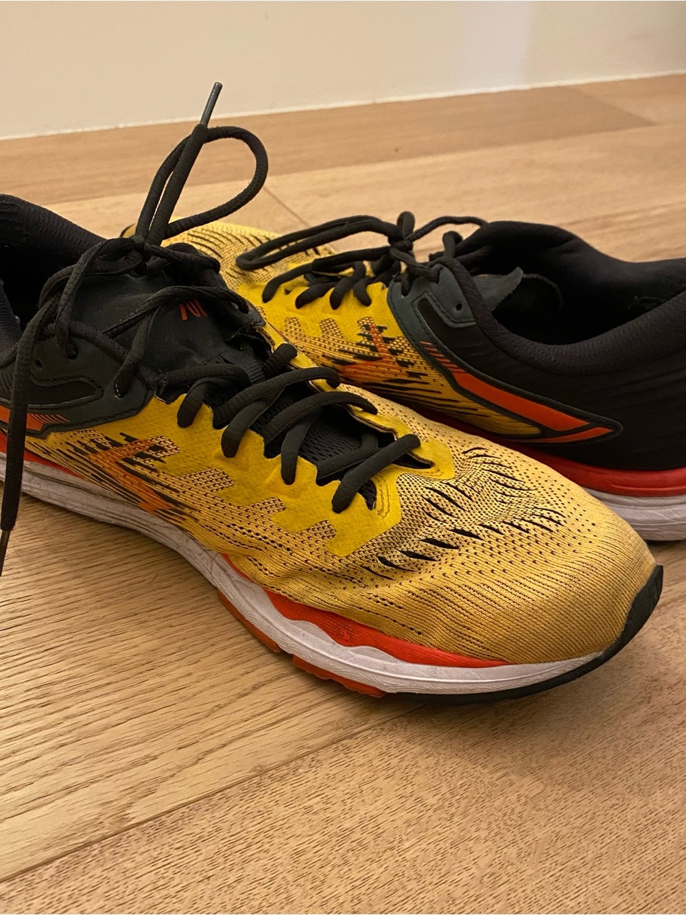 Yellow and Black Running Shoes with Orange Accents